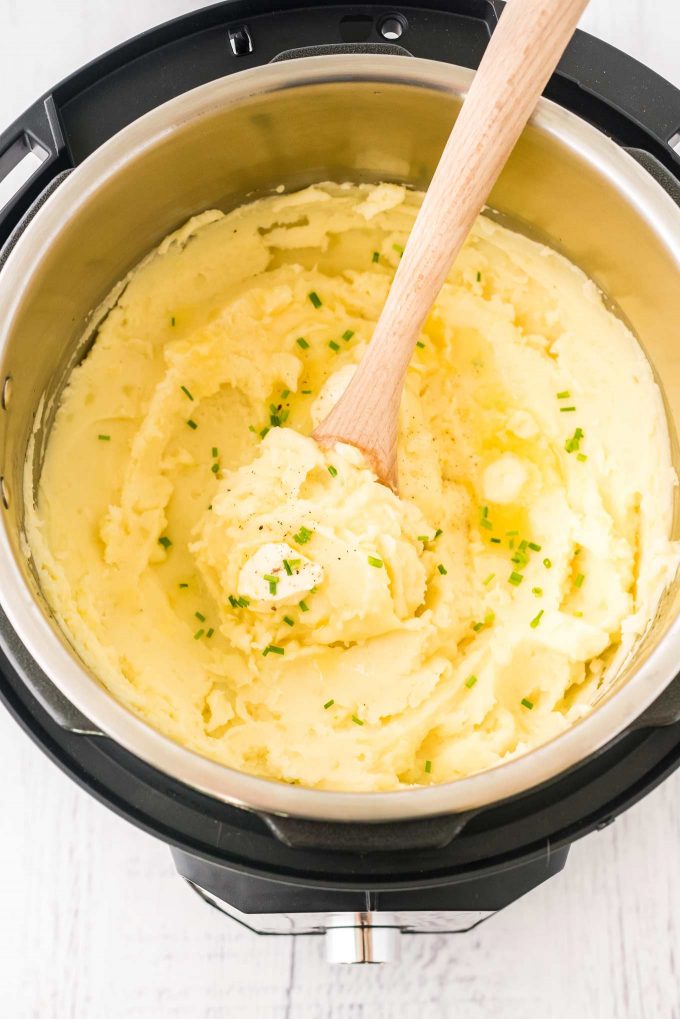 This classic recipe for perfect Instant Pot Mashed Potatoes is the only one you'll need!  So creamy, buttery and rich, they're great as a holiday side dish for Thanksgiving, or alongside a roast, steak, or juicy piece of chicken! #potatoes #mashedpotatoes #sidedish #side #holiday #thanksgiving #dinner #sundaydinner