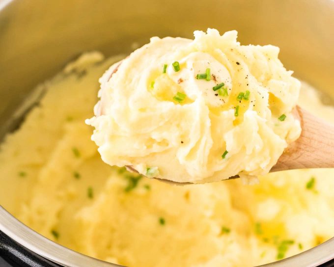 whipped potatoes on wooden spoon