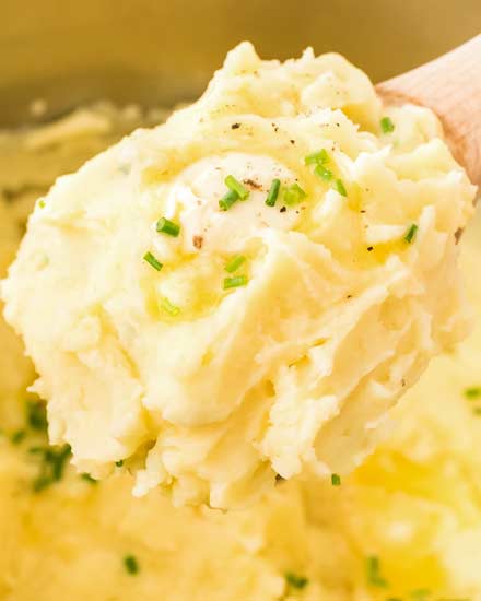 This classic recipe for perfect Instant Pot Mashed Potatoes is the only one you'll need!  So creamy, buttery and rich, they're great as a holiday side dish for Thanksgiving, or alongside a roast, steak, or juicy piece of chicken! #potatoes #mashedpotatoes #sidedish #side #holiday #thanksgiving #dinner #sundaydinner