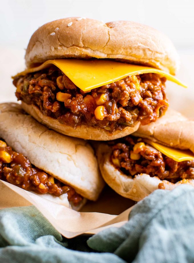 sloppy joes with cheddar cheese slice on bun
