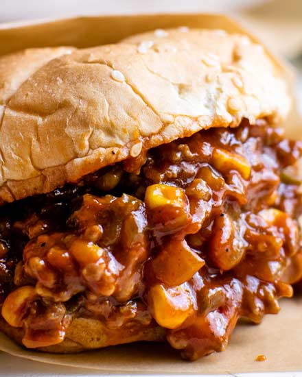 Perfect for a quick dinner, these Tex-Mex Sloppy Joes are ready in 30 minutes or less!  Made with beef, jalapenos, corn, and zesty spices, these sloppy joes will soon become a new family favorite! #sloppyjoes #texmex #easyrecipe #dinner #kidfriendly #sandwich #onepan #weeknight