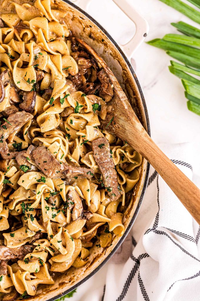 The Ultimate Beef Stroganoff is the most soul-warming comfort food around!  Tender beef strips, mushrooms and onions are smothered in a rich, beefy gravy and tossed with egg noodles.  Ready in about 30 minutes, it's a fabulous weeknight dinner option! #beef #beefstroganoff #stroganoff #comfortfood #dinner #weeknight #30minute #easyrecipe