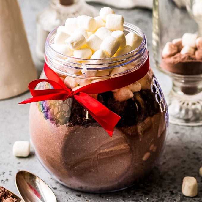 Jar of homemade hot chocolate mix with a red ribbon