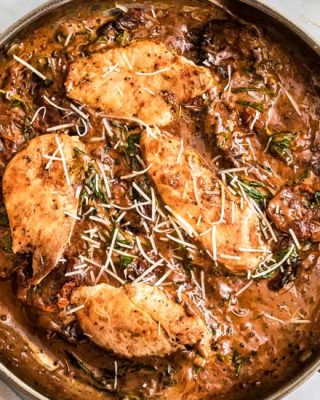 This One Pan Tuscan Chicken is a quick and easy one-pot meal that's sure to be a family favorite! Juicy chicken, a creamy sauce made with bursts of sun dried tomatoes, Parmesan cheese and spinach, and it's ready in about 30 minutes, making it a great weeknight dinner option. #chicken #tuscan #Italian #chickenbreast #chickenrecipes #onepot #onepan #dinner #easyrecipe #30minutemeal