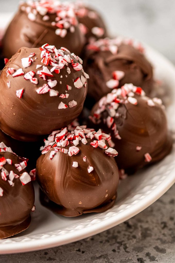 close up of hot cocoa truffle bombs with peppermint on top
