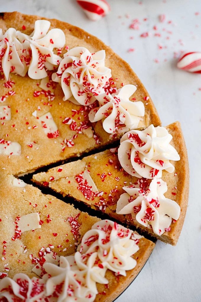 cutting a slice of sugar cookie cake