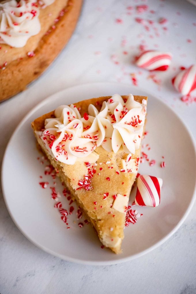 slice of a cookie cake on white plate with peppermint