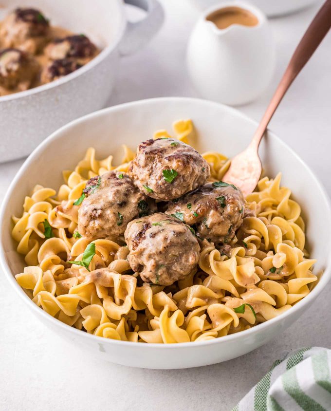 bowl of egg noodles and meatballs