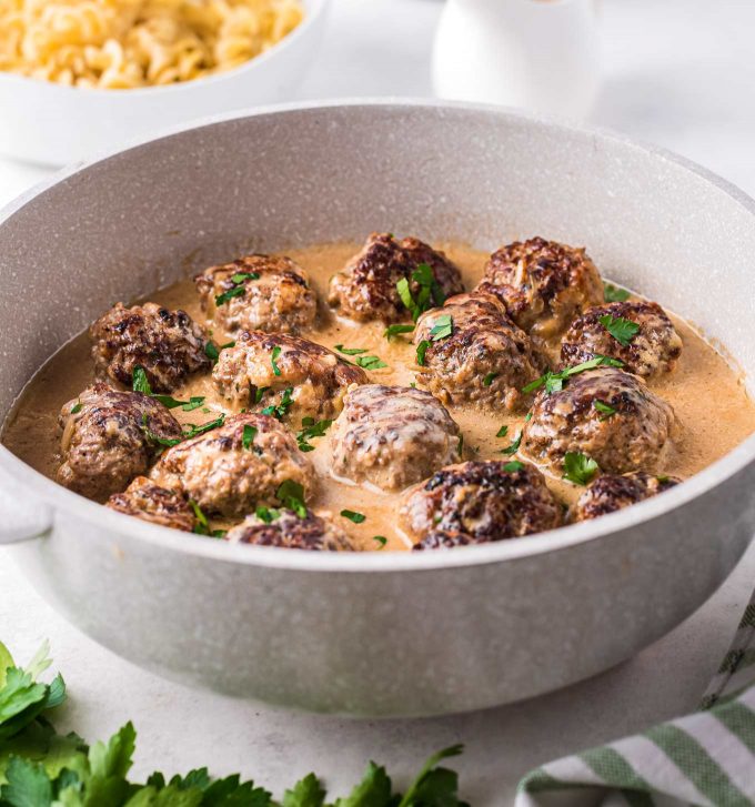 braising pan full of swedish meatballs in sauce