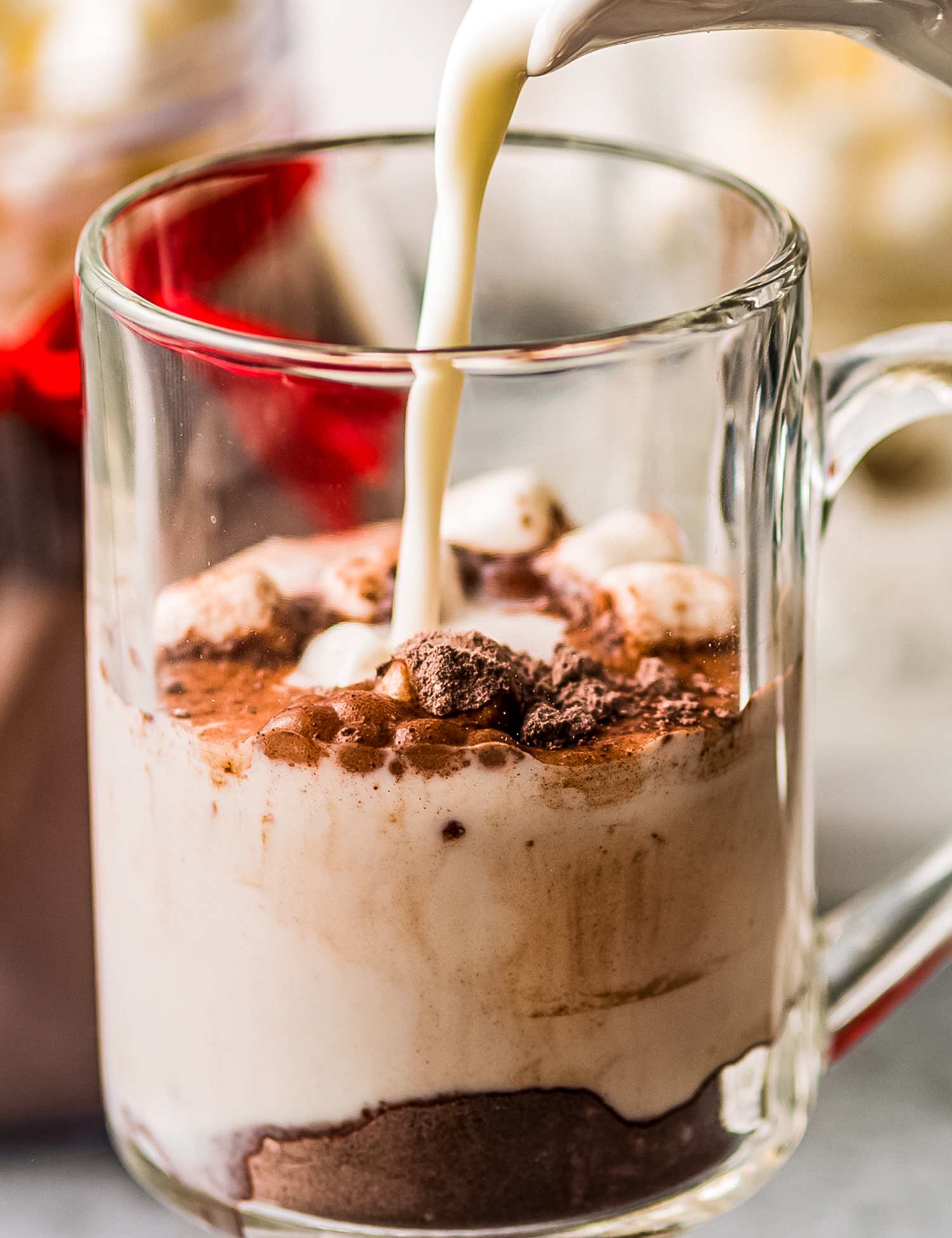 This Dark Hot Chocolate Mix is made with just a handful of simple ingredients, such as dark cocoa powder, powdered milk, sugar, and powdered creamer.  Top with mini chocolate chips and marshmallows and pour yourself a steaming hot mug of cocoa in just a minute or two! #hotchocolate #hotcocoa #darkchocolate #chocolate #cocoa #hotdrink #winter #holidays #homemademix #homemadegift