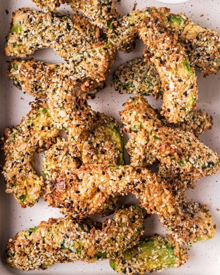 These everything bagel seasoned avocado fries are cooked in the air fryer and are a healthy and super easy side dish/appetizer.  Perfectly crispy on the outside and so creamy in the middle, they're great on their own with a dipping sauce, or as a topping on a burger or sandwich! #airfryer #airfryerrecipe #avocado #avocadorecipe #avocadofries #friedavocado #snack #appetizer