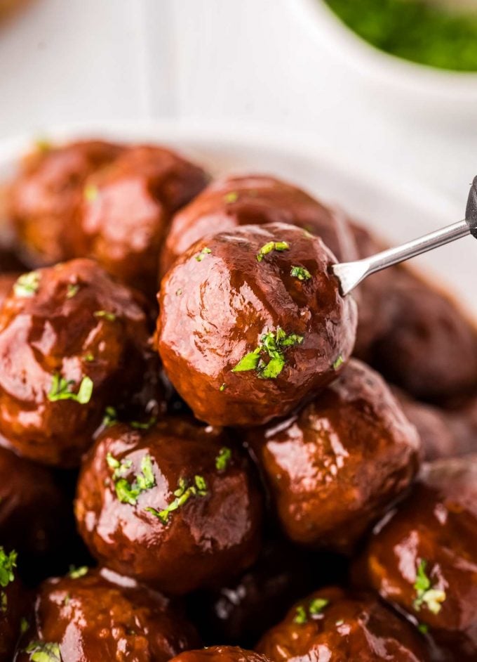 close up of bbq meatball on cocktail fork
