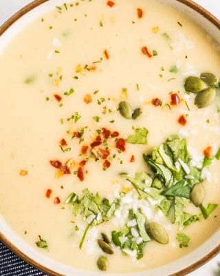 This Instant Pot cauliflower soup is quick and easy. Using simple ingredients, this soup is low carb, vegan, and gluten free. Flavored with warm curry spices, garlic and ginger and finished with creamy coconut milk, this is a cozy soup you can feel good about eating! #cauliflower #soup #instantpot #pressurecooker #vegan #lowcarb #keto #glutenfree