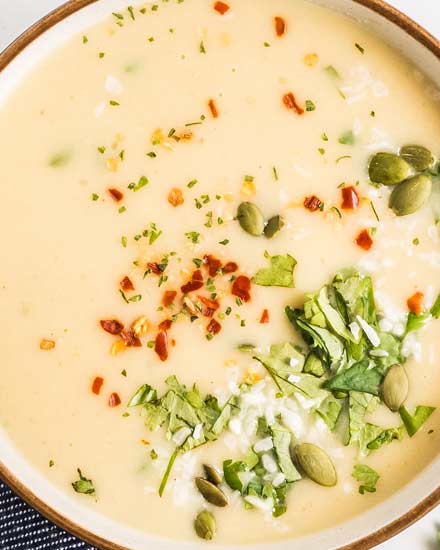 This Instant Pot cauliflower soup is quick and easy.  Using simple ingredients, this soup is low carb, vegan, and gluten free.  Flavored with warm curry spices, garlic and ginger and finished with creamy coconut milk, this is a cozy soup you can feel good about eating! #cauliflower #soup #instantpot #pressurecooker #vegan #lowcarb #keto #glutenfree