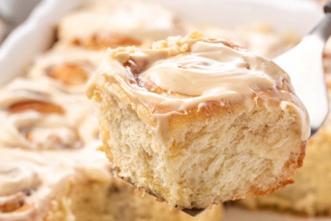 homemade cinnamon roll on spatula