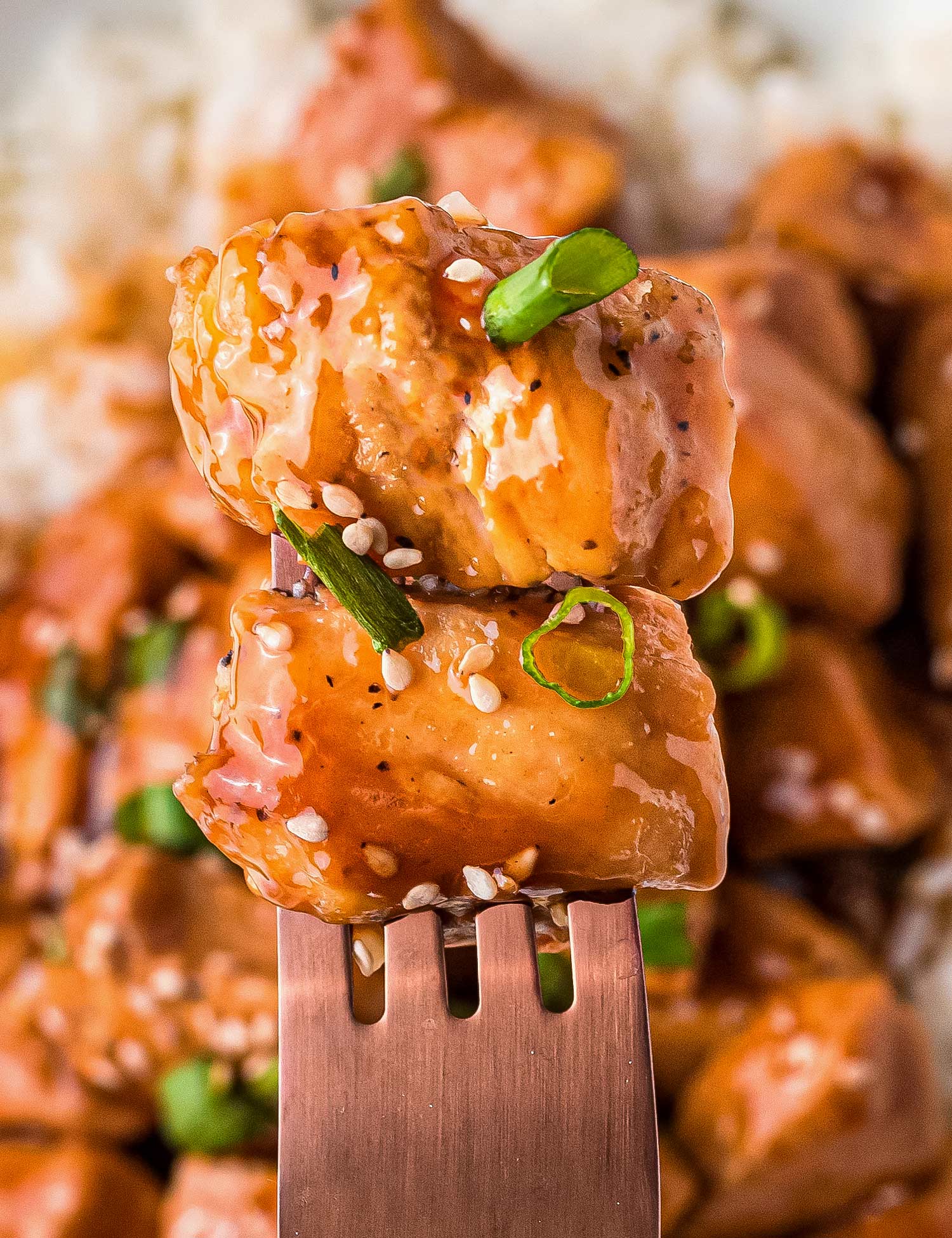 This recipe for Bourbon Chicken is so easy to make, with tender, juicy bites of chicken and a gloriously sweet and sticky sauce that clings to each bite. Make it in just 30 minutes, and you’ll have a weeknight dinner the whole family will love! #bourbonchicken #chicken #chickenbreast #bourbon #asian #chinese #takeout #stirfry