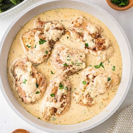 chicken thighs with mustard sauce in skillet