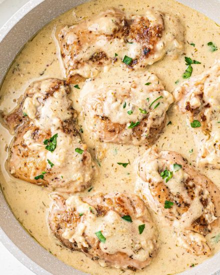 Simple and easy, these Chicken Thighs with Creamy Mustard Sauce are made in one pan, and ready in about 30-40 minutes! Packed with bold and rich flavors, this is a great weeknight dinner idea. The mustard sauce is perfect over veggies, potatoes and more! #chicken #thighs #mustard #onepan #onepot #dijonmustard #mustardsauce