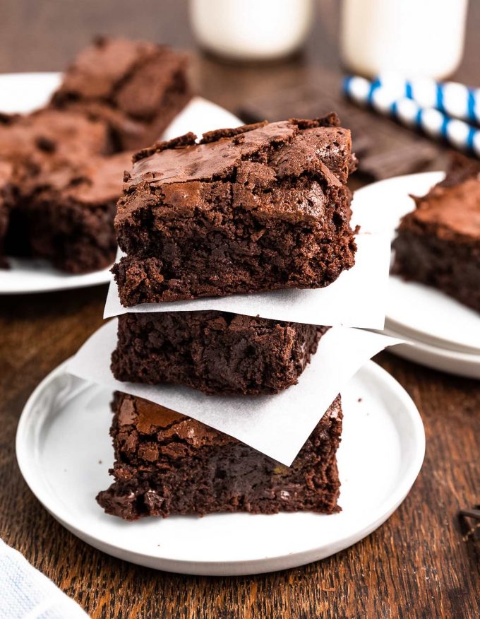 stack of brownies with parchment squares