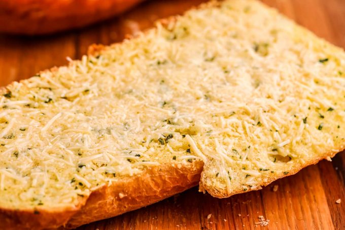 close up view of crispy garlic bread with cheese