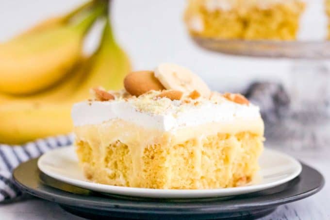 slice of banana pudding poke cake on white plate