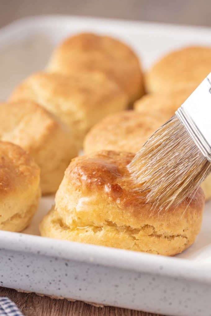 brushing biscuit with melted butter