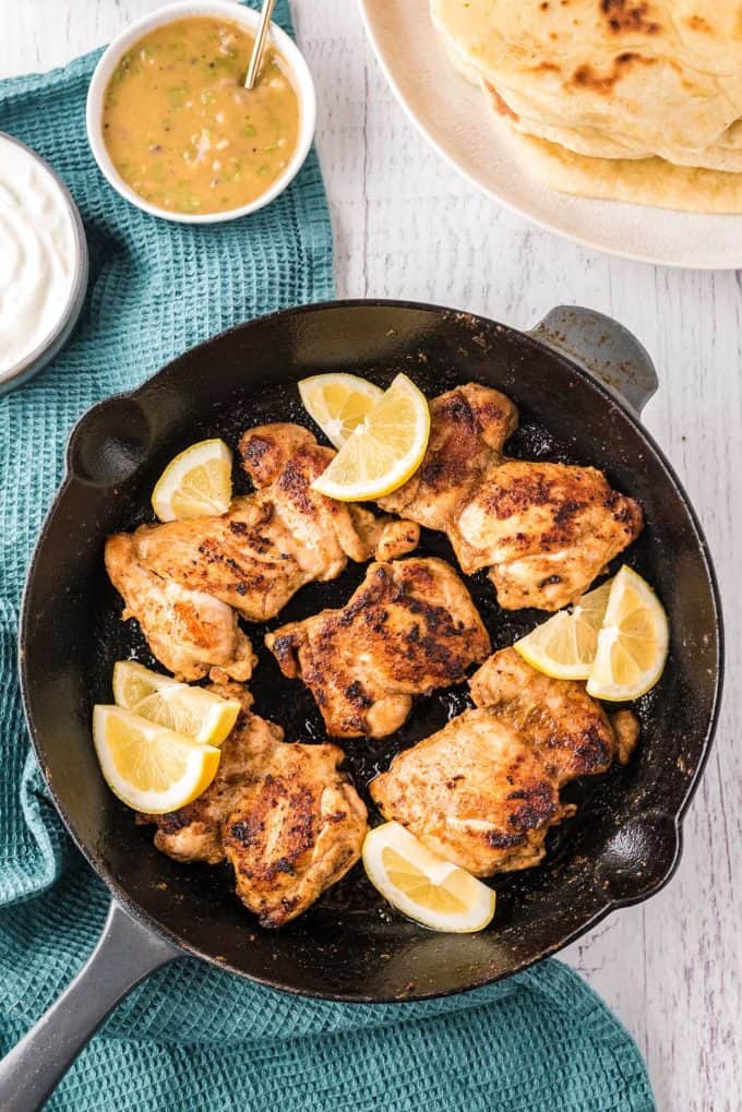 cooked chicken thighs in skillet