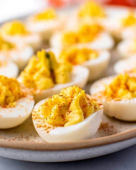 These Classic Deviled Eggs are so creamy, full of flavor, and easy to make. Perfect for a bbq, potluck, holidays, and more! This is a base recipe that you can play around with and add fun flavors to! #deviledeggs #deviled #hardboiledeggs