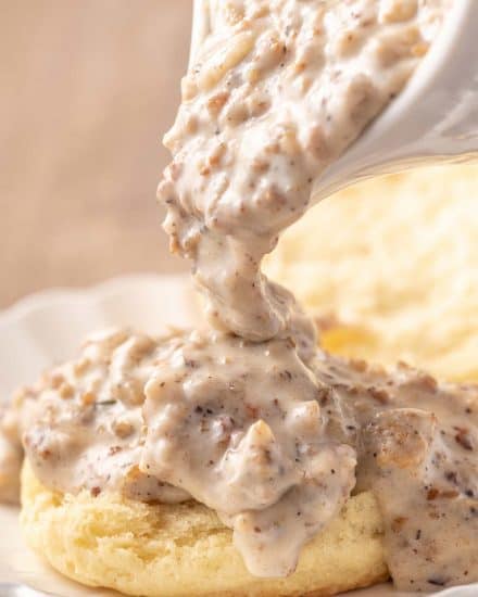 This Classic Sausage Gravy recipe is creamy, peppery, made from scratch, and just the perfect comfort food! Made in just 20 minutes, and just great for slathering over some biscuits. #sausagegravy #biscuitsandgravy #sawmillgravy #breakfast