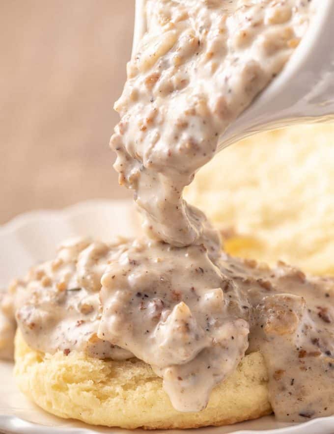 This Classic Sausage Gravy recipe is creamy, peppery, made from scratch, and just the perfect comfort food! Made in just 20 minutes, and just great for slathering over some biscuits. #sausagegravy #biscuitsandgravy #sawmillgravy #breakfast