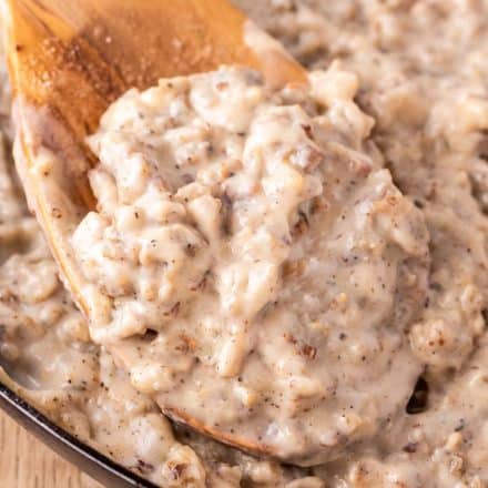 wooden spoon of sausage gravy