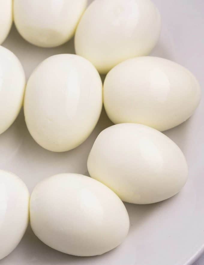 plate of peeled hard boiled eggs