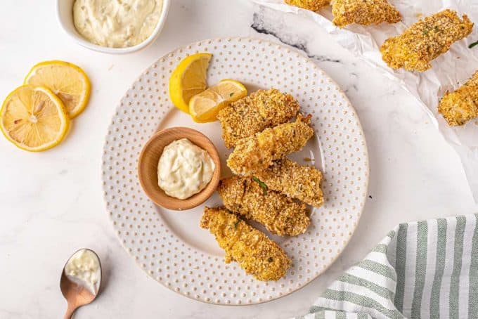 fish sticks on plate with tartar sauce