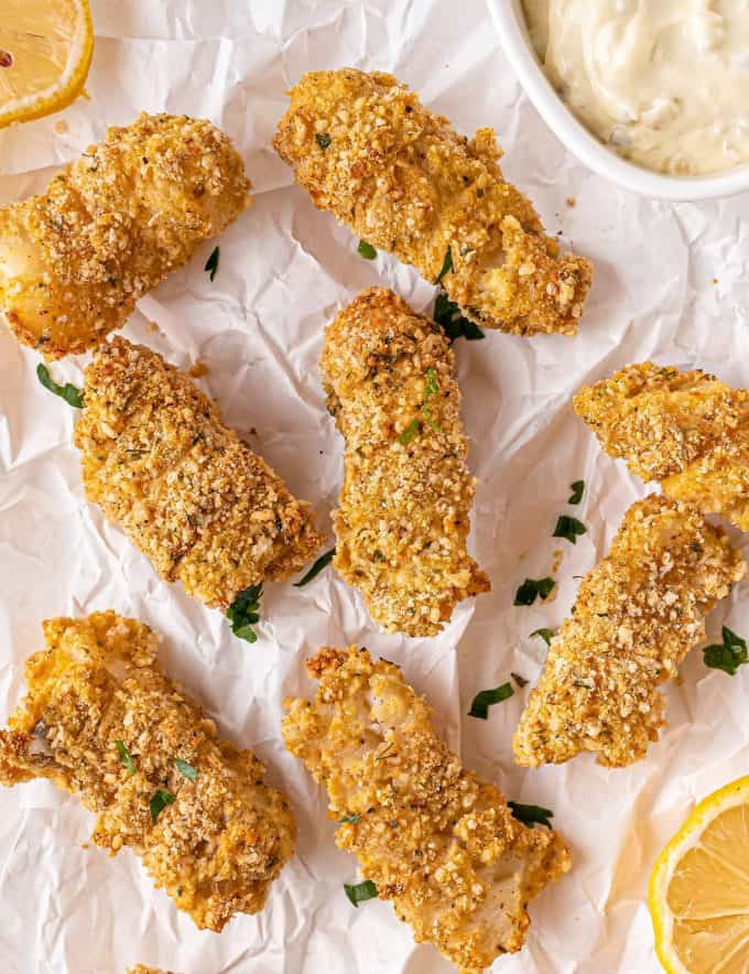 These Parmesan Baked Fish Sticks are so crispy on the outside and flaky on the inside. Made from real fish filets, this kid-approved and freezer-friendly recipe is so much better than any box from the frozen foods section! #fishsticks #bakedfish #crispyfish #homemaderecipe