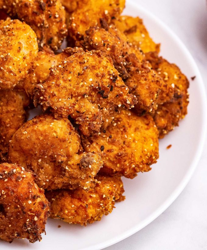 pile of fried shrimp on white plate