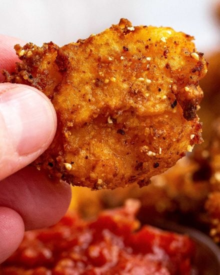 These Southern-Style Fried Shrimp are so juicy and tender, with the crispiest crust. Deep fried in a buttermilk and flour/cornmeal batter, they're perfect with cocktail sauce as an appetizer, or a fun dinner! #shrimp #friedshrimp #popcornshrimp #seafood #southernfood