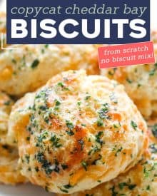 These Copycat Cheddar Bay Biscuits are buttery, garlicky, cheesy, fluffy, and ready in less than 30 minutes! No rolling and cutting needed and they're made from scratch. #biscuits #cheddarbay #copycat #redlobsterbiscuits