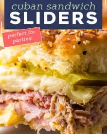 These Cuban Sliders are a fun appetizer version of the classic Cuban sandwich! Loaded with ham, pulled pork, mustard sauce, cheese and pickles, you'll love every bite of these delicious crowd-pleasing sliders. #sliders #cuban #ham #pork #appetizers #fingerfoods #partyfood