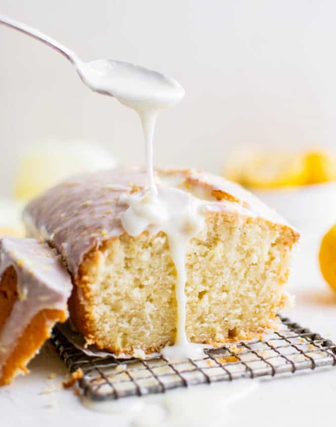 pouring glaze over lemon pound cake