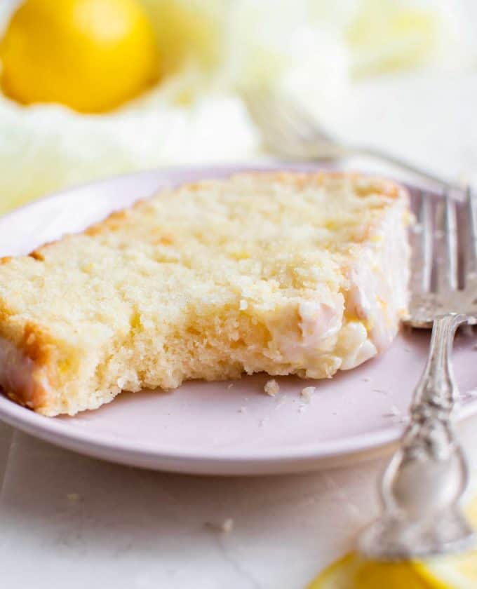 two slices of pound cake, one with a bite taken out of it