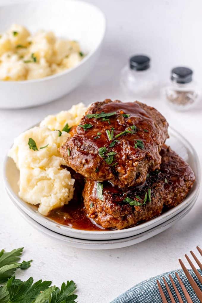 stout bbq salisbury steaks on plate with mashed potatoes