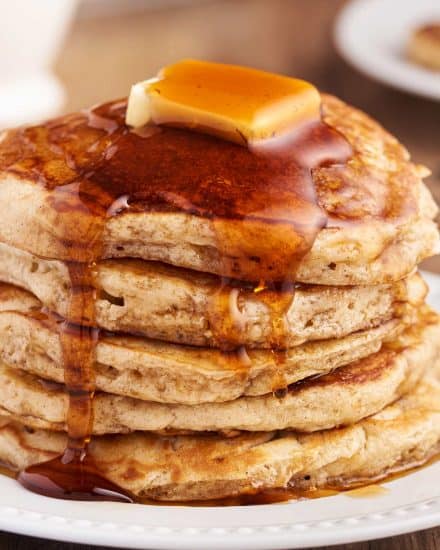 Start your morning off right with a big stack of these fluffy and melt in your mouth Buttermilk Pancakes. This old-fashioned recipe is so easy, tastes way better than a boxed mix, and gives you pancakes with the most perfectly crisp edges and soft fluffy centers. #pancakes #buttermilk #flapjacks #oldfashionedrecipe #fromscratch #homemade