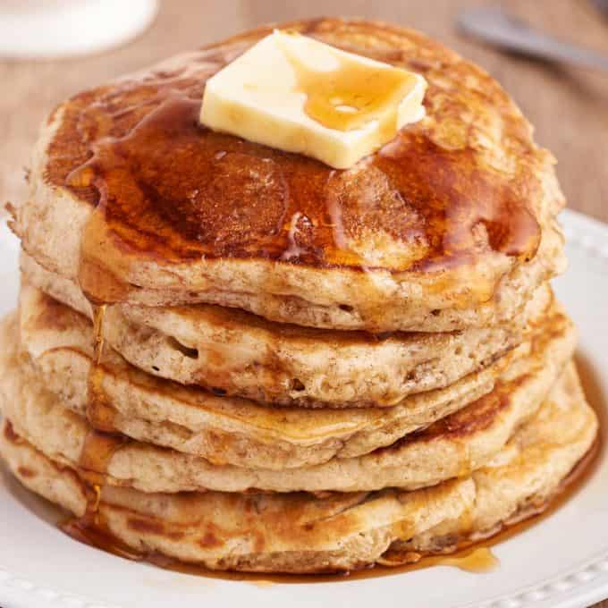 stack of buttermilk pancakes on white plate