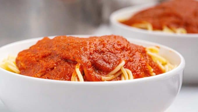 spaghetti covered in marinara sauce