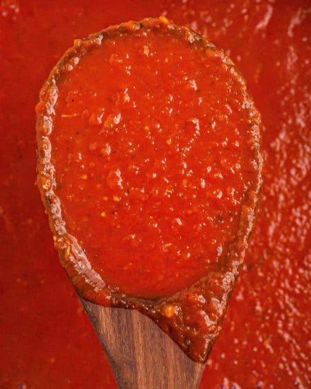 This recipe for Homemade Marinara Sauce is ready in about 30 minutes, uses simple ingredients, and is freezer friendly. So much better than anything from a jar, it's perfect on pasta, as a dipping sauce, and more! #marinara #italian #homemade #pastasauce