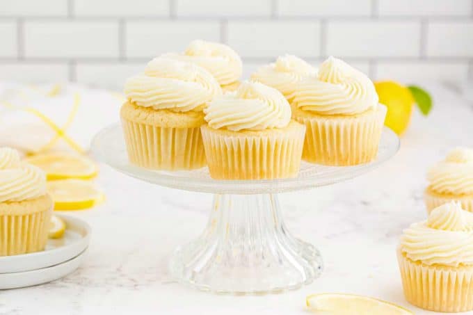 lemon cupcakes on glass cake stand