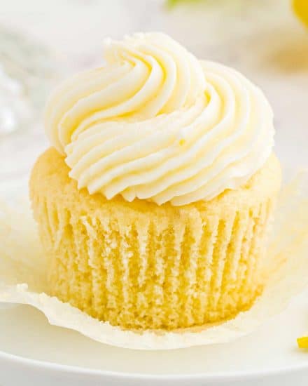 These amazing Lemon Cupcakes are fluffy, moist and easy to make from scratch. They have the perfect flavor balance of tangy and sweet, and have a super tender crumb. Top with your favorite buttercream and enjoy! #cupcake #lemon #dessert #baking #cake #cupcakerecipe