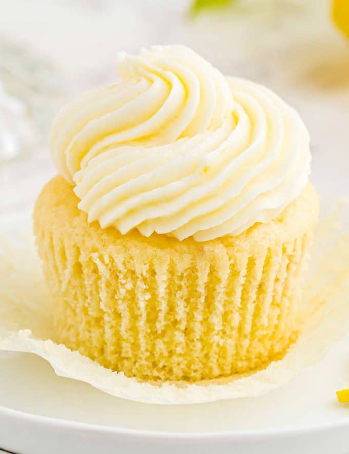 These amazing Lemon Cupcakes are fluffy, moist and easy to make from scratch. They have the perfect flavor balance of tangy and sweet, and have a super tender crumb. Top with your favorite buttercream and enjoy! #cupcake #lemon #dessert #baking #cake #cupcakerecipe