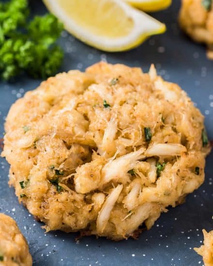 These crab cakes are made Maryland-Style with sweet lump crab, Old Bay and with little filler. Brushed with melted butter and baked to tender perfection! #seafood #crab #crabcakes #maryland