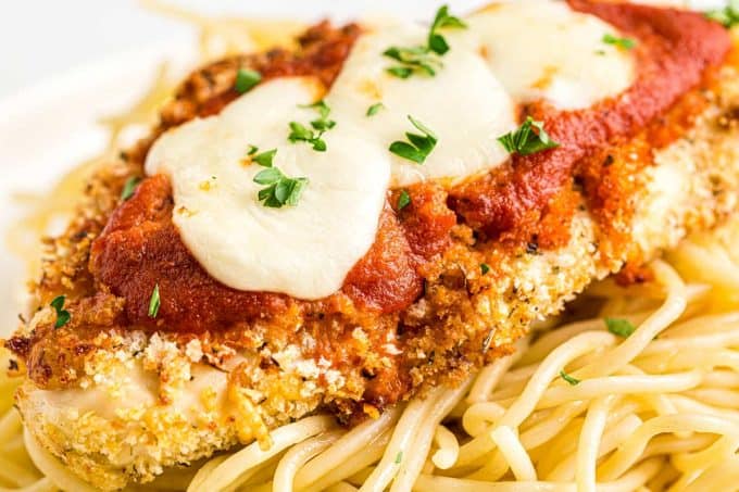 This Air Fryer Chicken Parmesan is made super easily with a handful of ingredients, uses less oil, and no messy pan-frying! Air fryer and oven instructions included. #airfryer #chickenparmesan #chickenrecipes